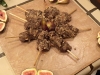 Rib eye skewers with mango salsa dipped in crushed pecans