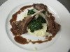 Roasted rack of lamb, sautéed spinach, garlic mashed potatoes, rosemary and red wine pan reduction sauce