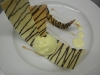 Zebra chocolate drizzeled coulis with vanilla ice cream